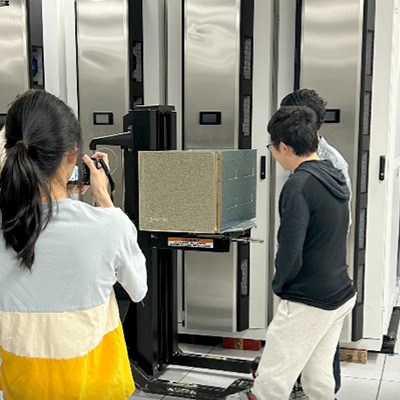 Members of the Hao Lab around the DGX B200 in SDSC’s Data Center. Photo courtesy of SDSC.
