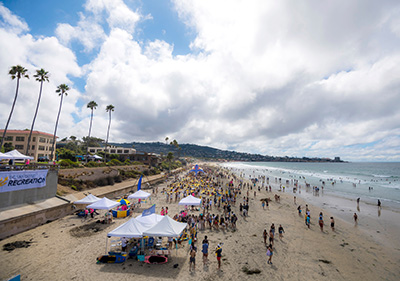 La Jolla Shores beach with students and tents on a sunny day. 