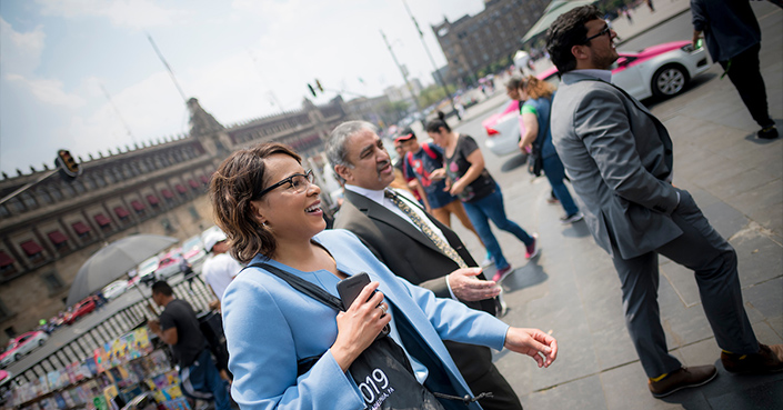 Vice Chancellor for Equity, Diversity and Inclusion Becky Petitt walking in Mexico alongside Chancellor Pradeep Khosla on a university trip.