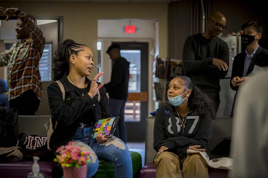 Prospective student Janell Thompson with other community members at the welcome event.