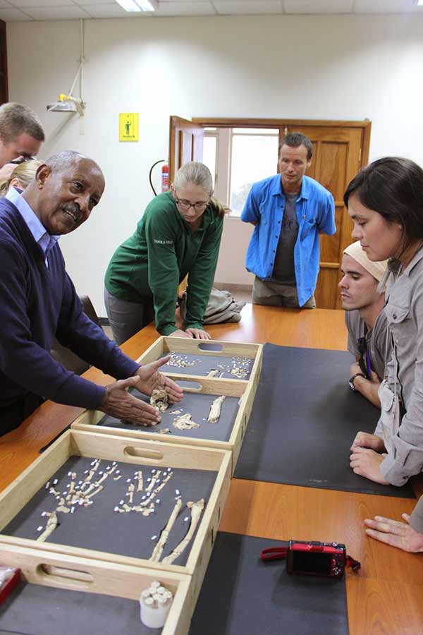 Dr. Berhane Asfaw showing UC San Diego graduate students the original fossils of Ardi.