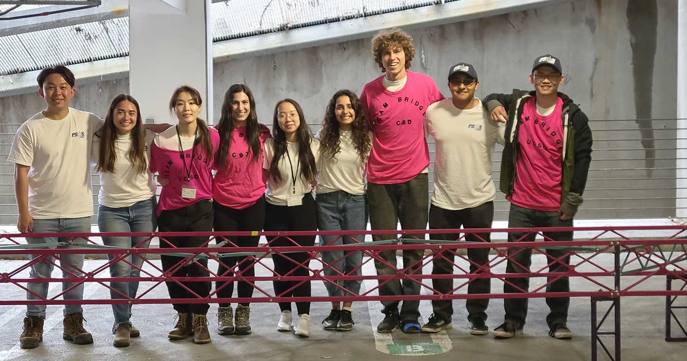 first-place winning steel bridge team with their bridge.