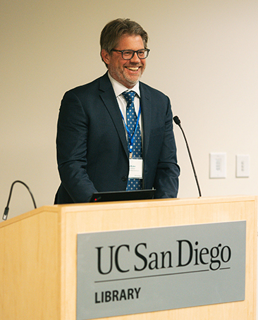 Teaching + Learning Commons faculty director David Ruiter speaks at the podium to speak during the anniversary celebration