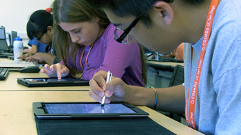 students on iPads.