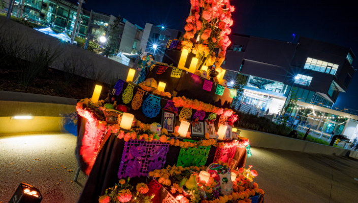 Dia de Los Muertos Altar lit with candles