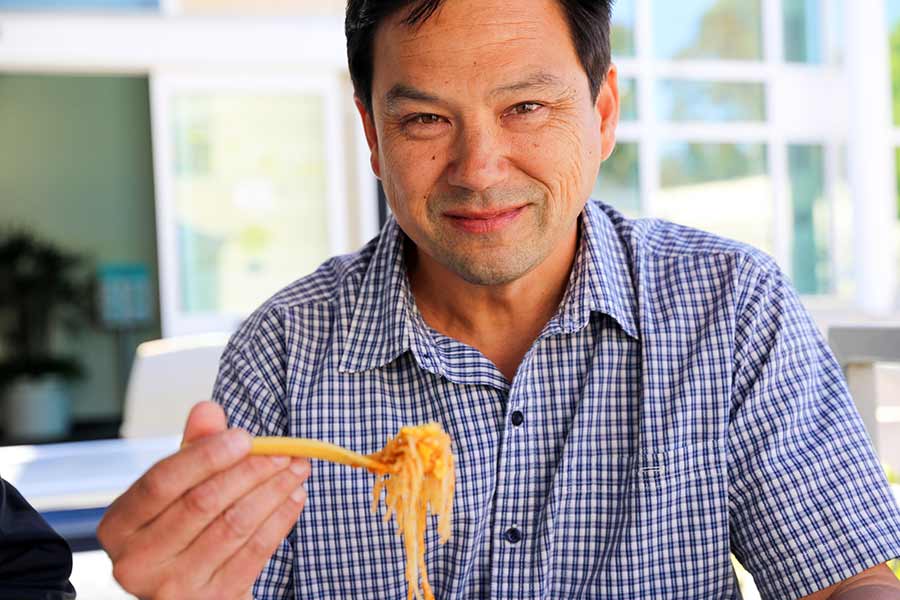 Albert Liu using the edible fork