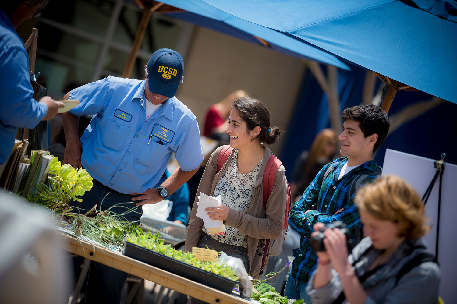 Students in front of table with plants