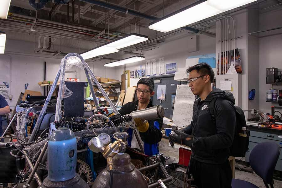 Engineering students working welding