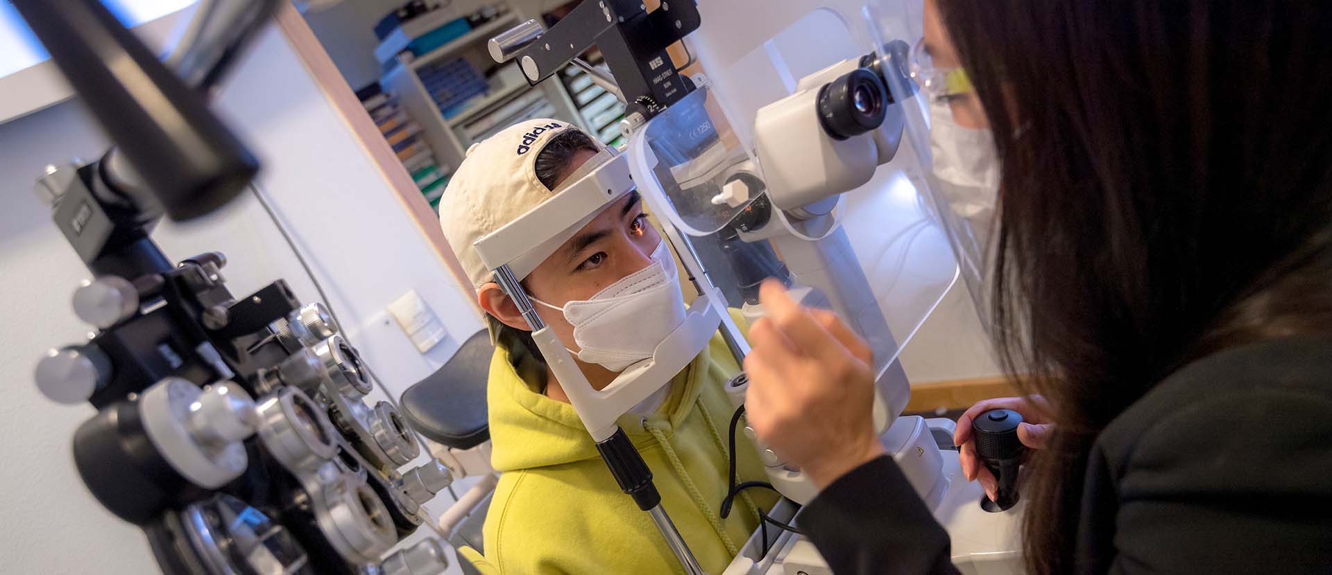 A student takes part in an eye exam