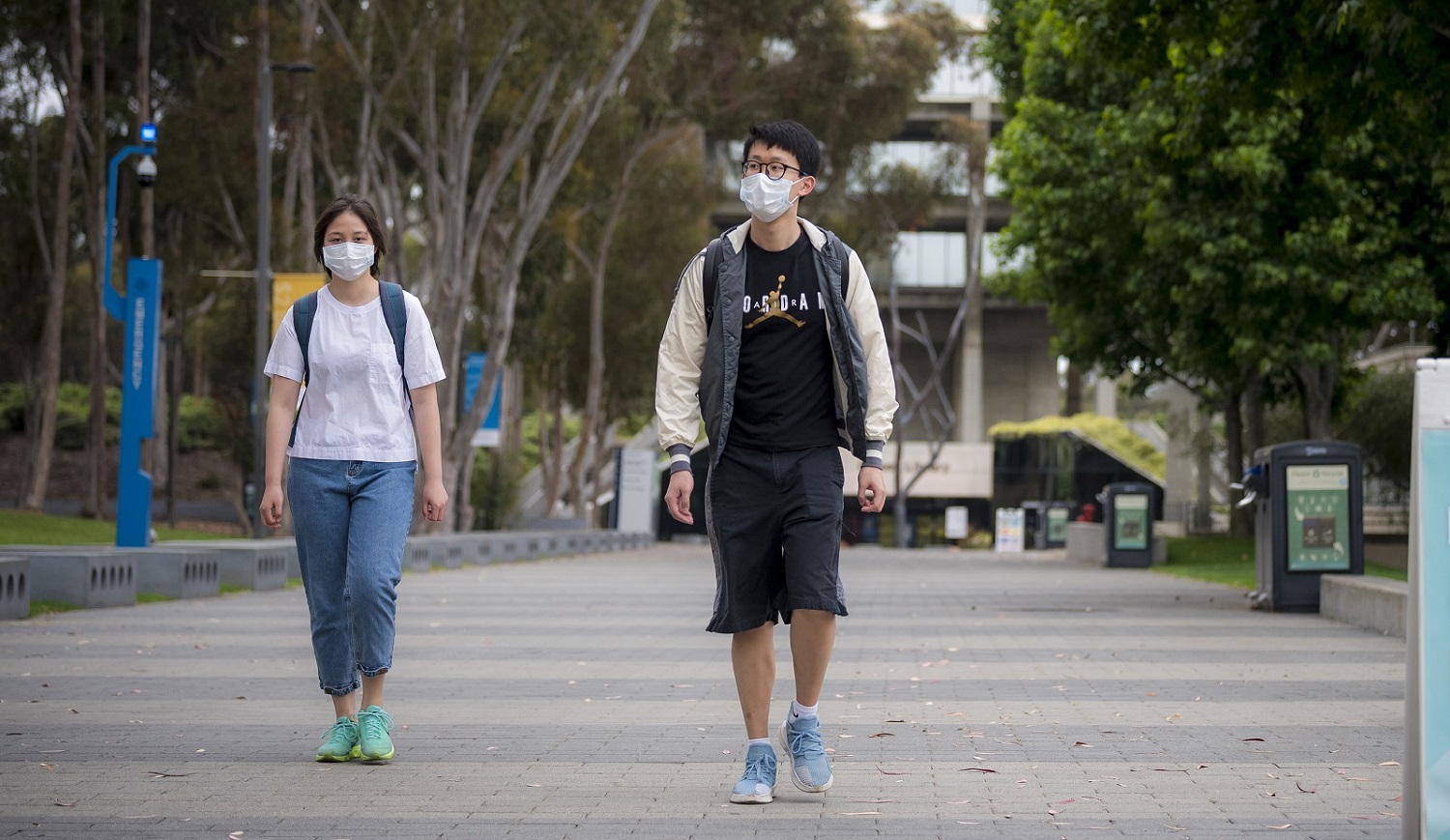 two students wearing facemasks at UCSD