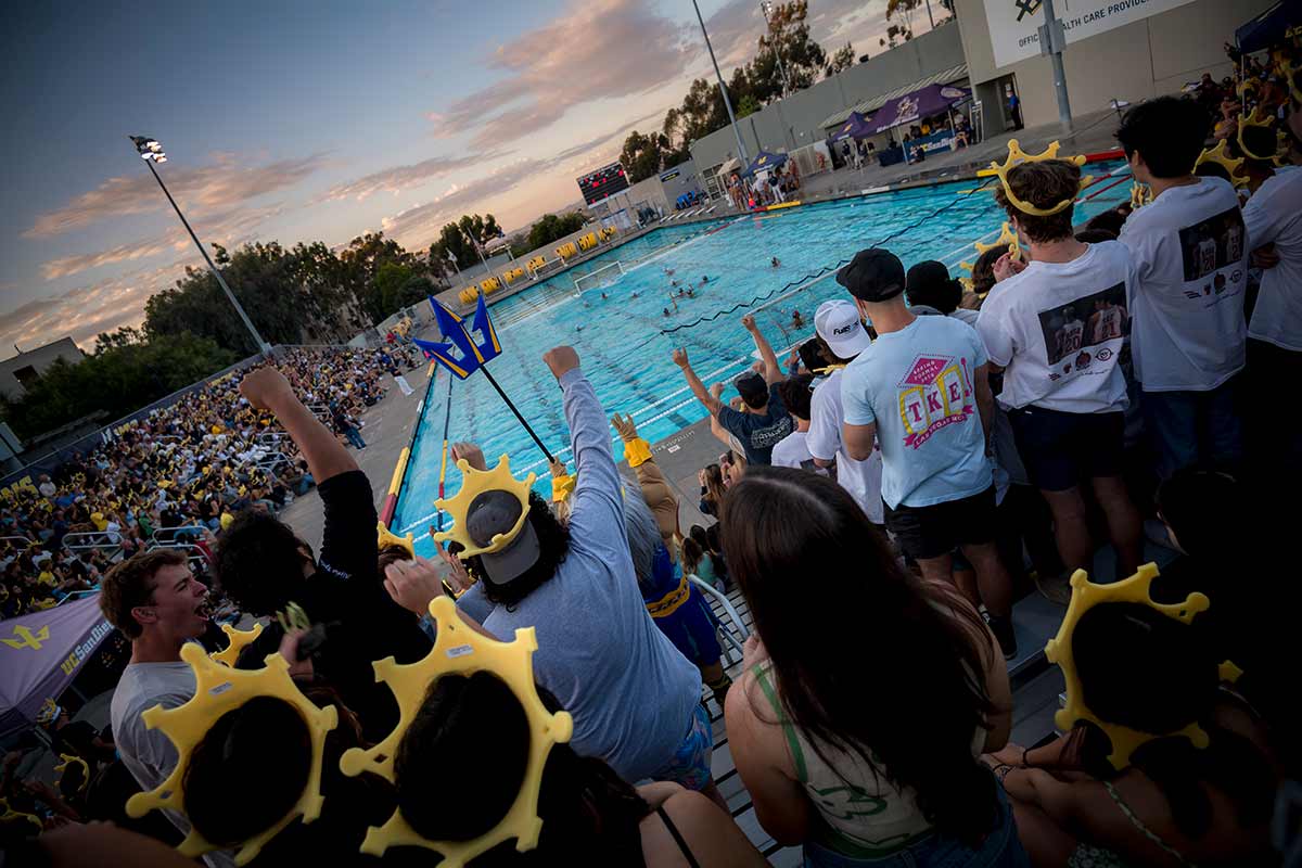 Fans cheering at a water polo game