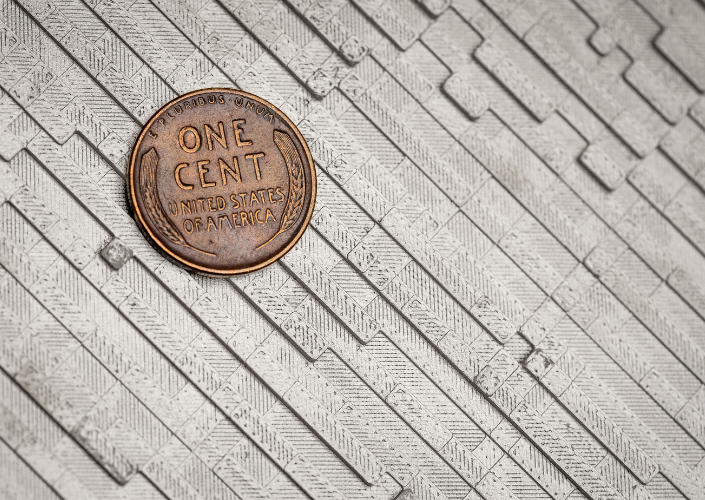 a closeup of the tile with a penny for scale
