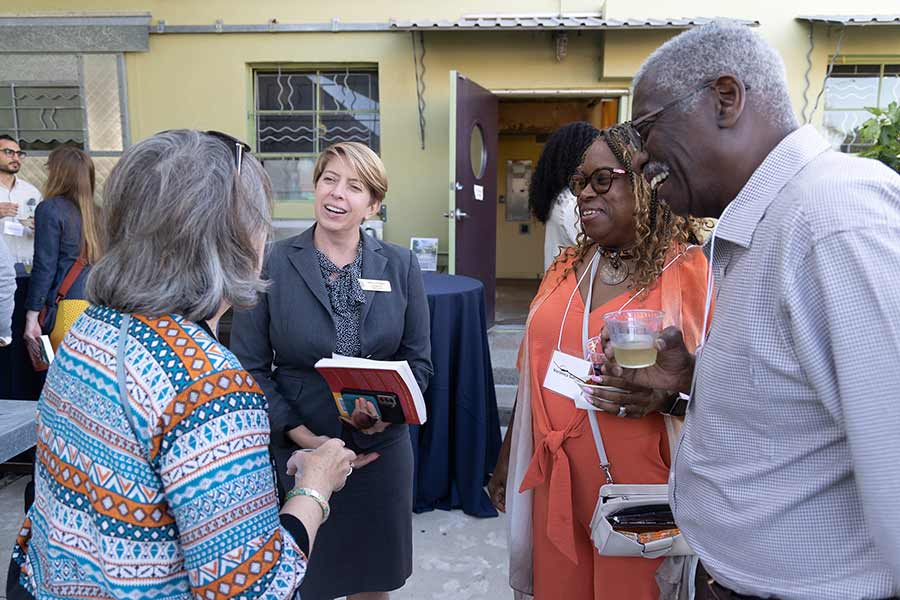 San Diego District 5 Councilmember Marni von Wilpert chats with other book forum attendees. Photo credit: Kevin Walsh Photography.