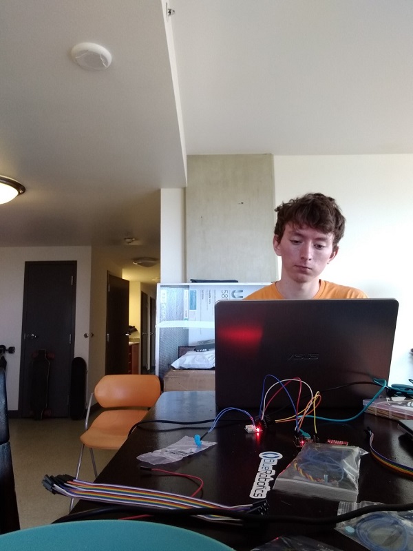 student on laptop working on a prototype