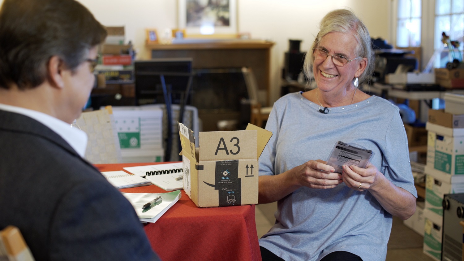 woman and therapist going through boxes