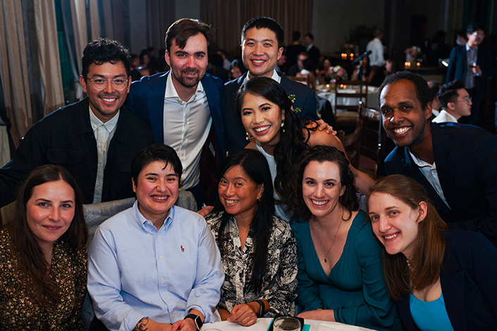 Image of Pham at her wedding with a group of Preuss alumni