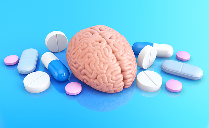Illustration of a brain with pills surrounding.