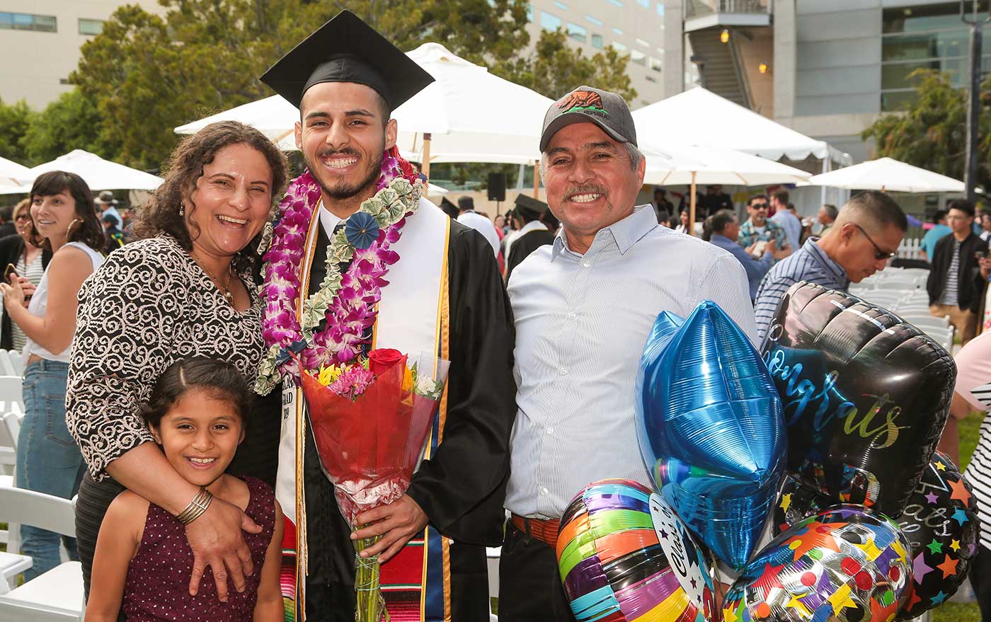 UC San Diego grad with family.