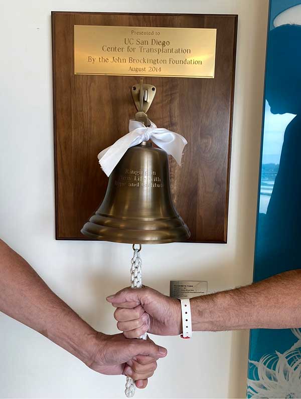 Andy and Mike Partridge ring the bell at UC San Diego Health's Center for Transplantation.