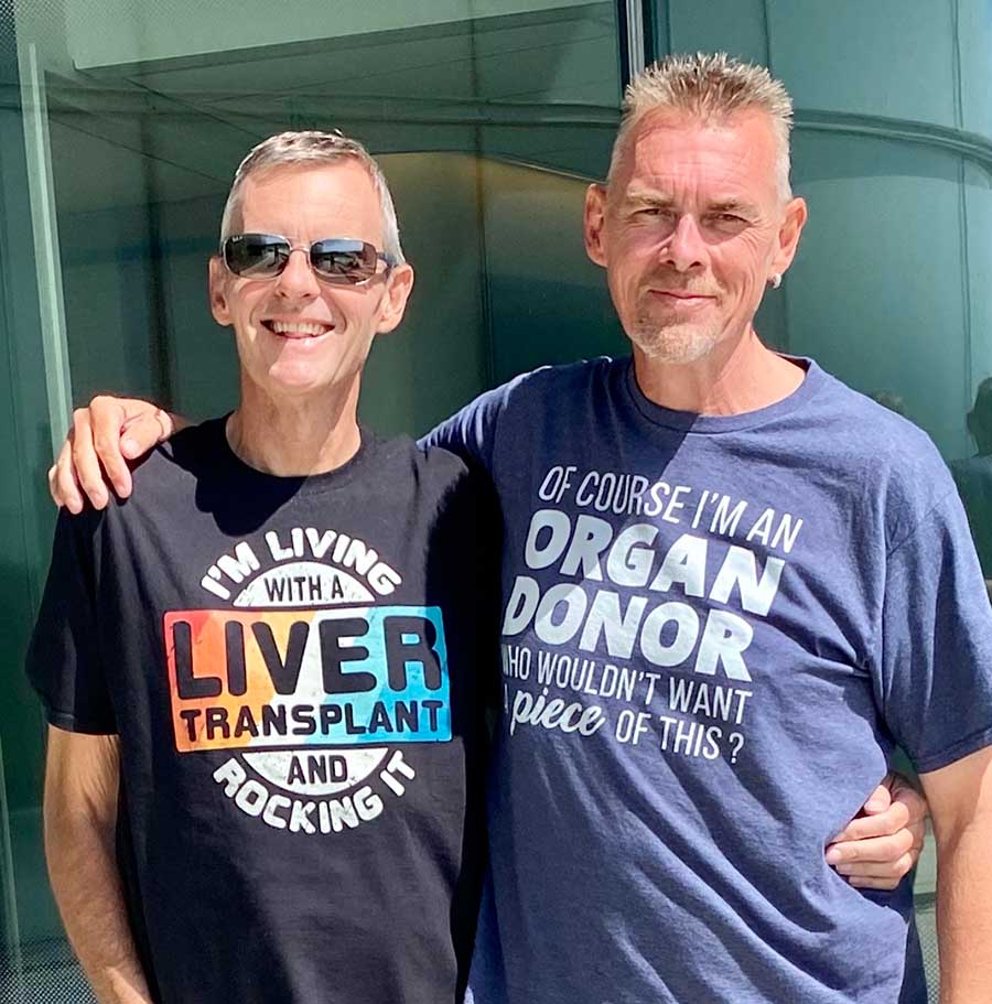 Andy and Mike Partridge wear smiles and witty shirts post-liver transplant.