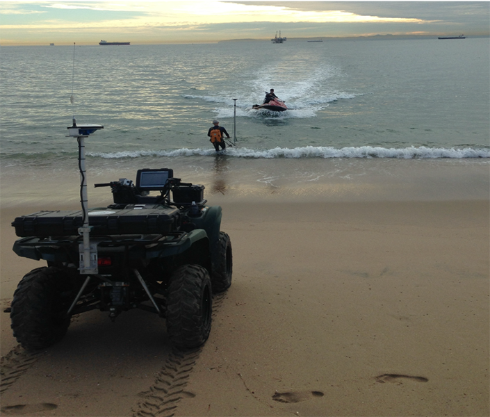ATV, dolly and jetski being used to measure a beach