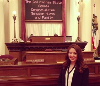Female standing in the California State Assembly Chamber