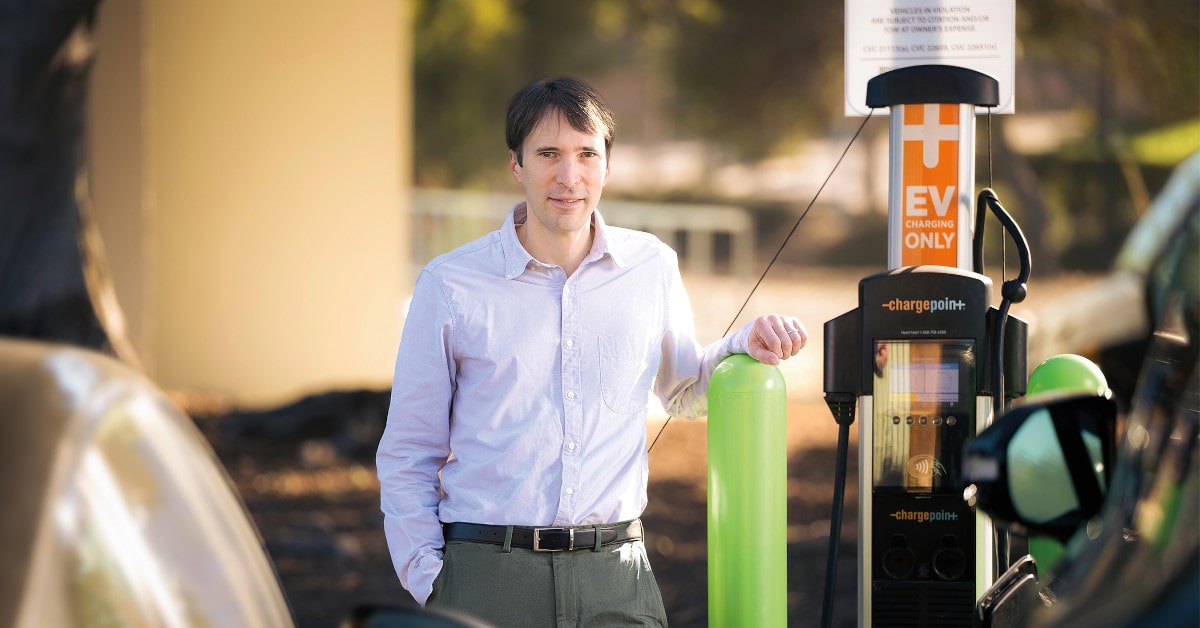 Mark Jacobsen at EV charging station