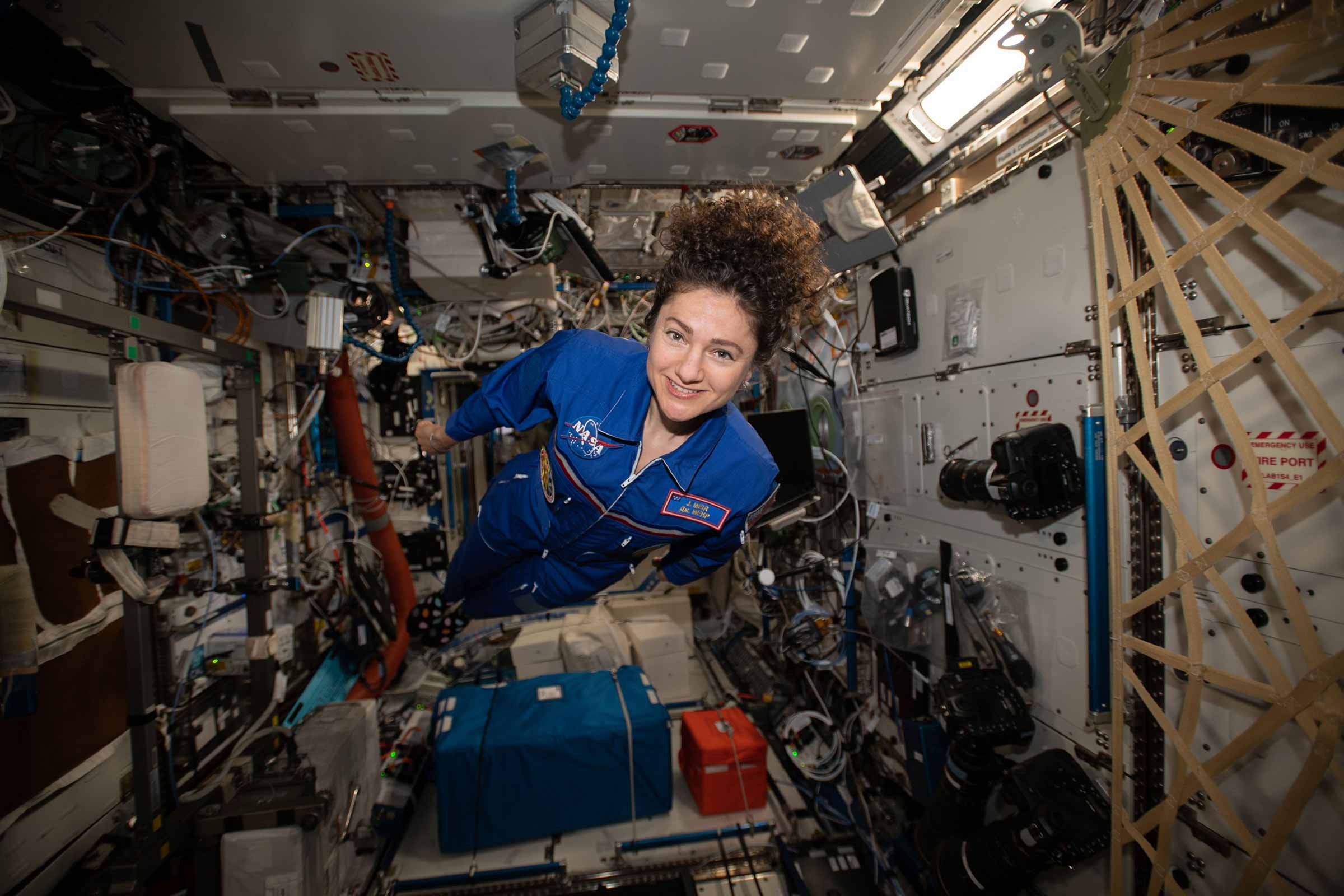 Meir hovers for a portrait in the weightless environment of the International Space Station.