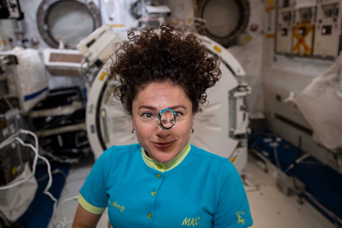 Meir observes a floating sphere of water formed by microgravity inside the International Space Station's Kibo laboratory module.