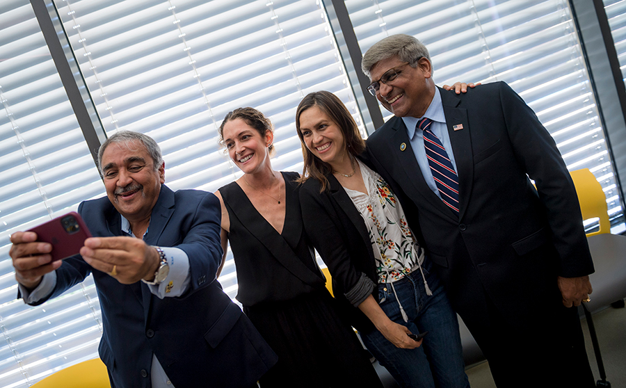 Chancellor Khosla takes a selfie with professors Rommie Amaro and Elizabeth Villa and NSF Director Panchanathan.