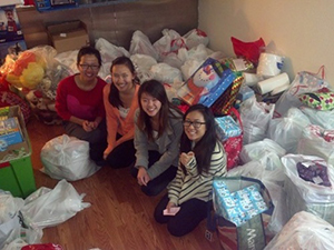 Image: Members of Operation Santa with gifts before making deliveries to families in need.