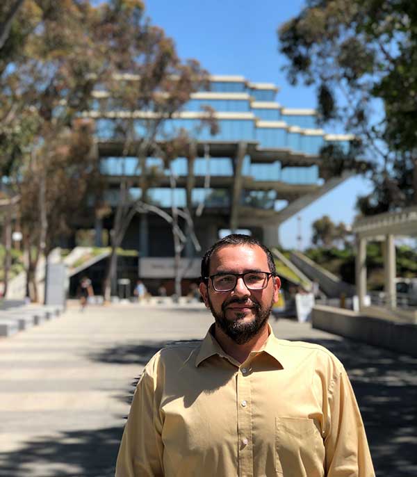 Jose Perez in front of Giesel Library