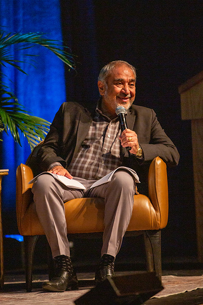 Pradeep K. Khosla holding microphone.