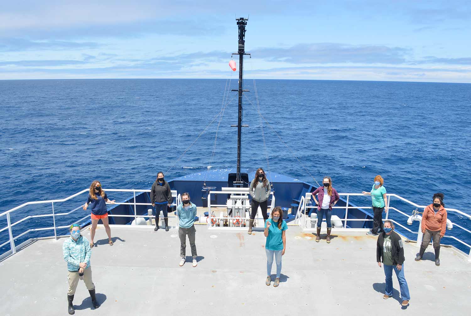 Women on Sally Ride vessel posing for photo