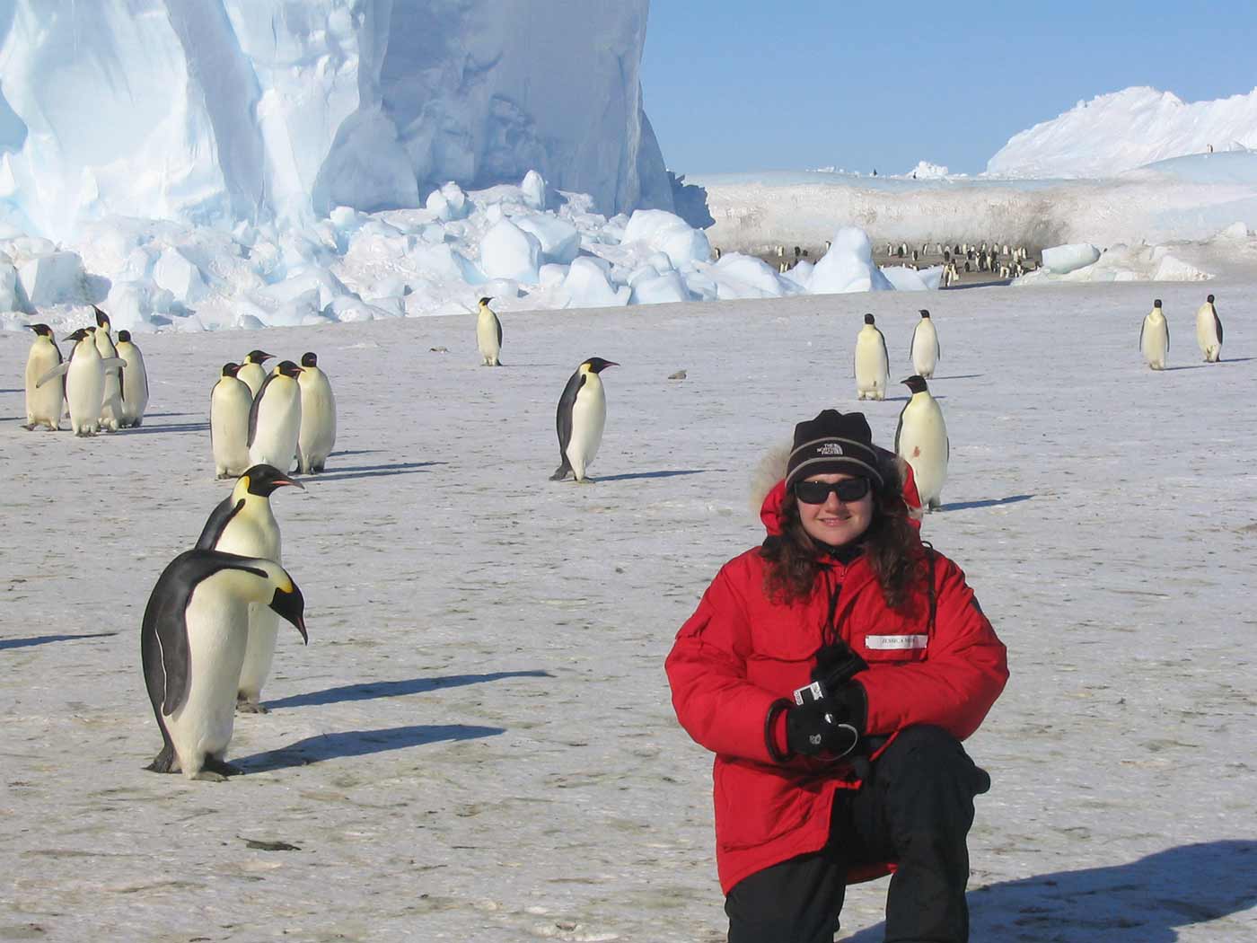 Jessica Meir in Antartica with penguins