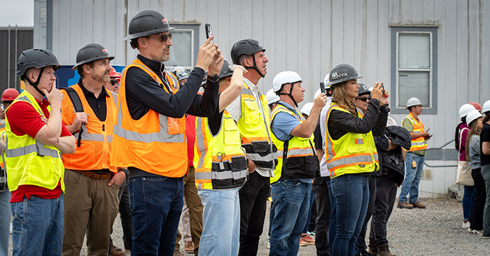 Picture of a crowd holding up phones
