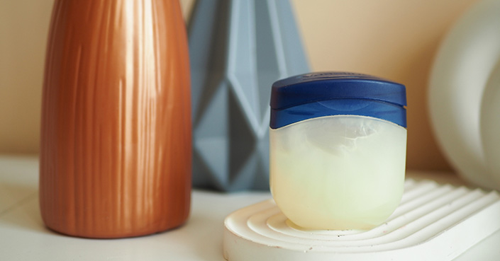 Jar of vaseline on table