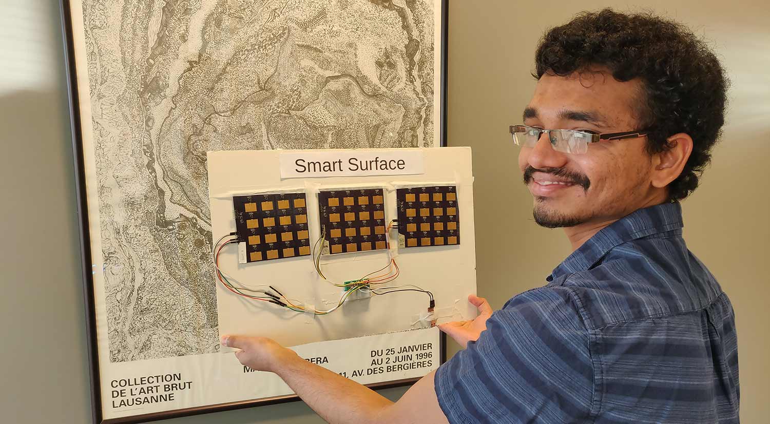 Researcher demonstrating Smart Surface