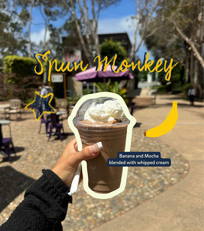 Hand holding a frozen coffee with whipped cream. Text reads: Spun Monkey: Banana and mocha blended with whipped cream