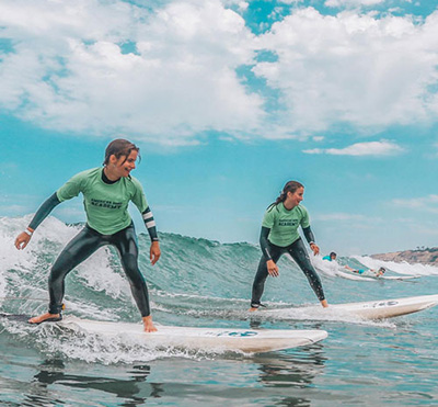 Two children surfing