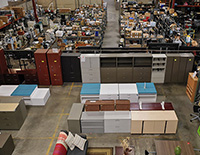 A Surplus Sales warehouse that has office and home furniture.
