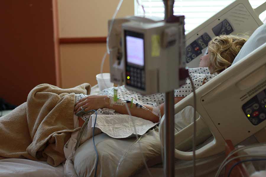 woman in hospital bed.