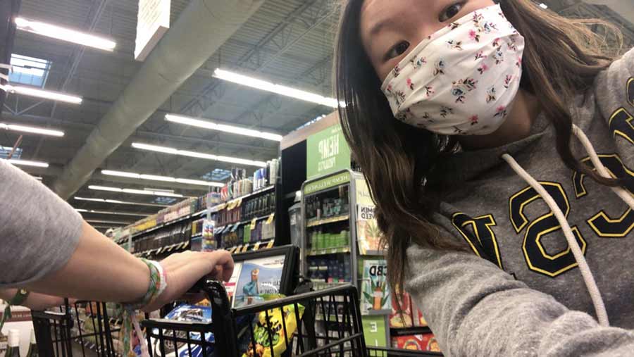 Paige Nguyen masked in a grocery store.