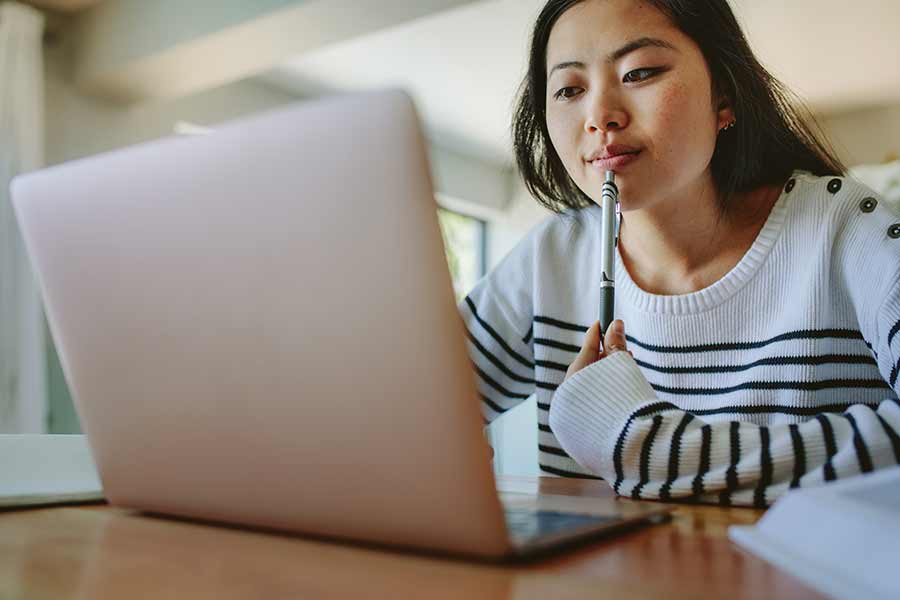 student looking at laptop