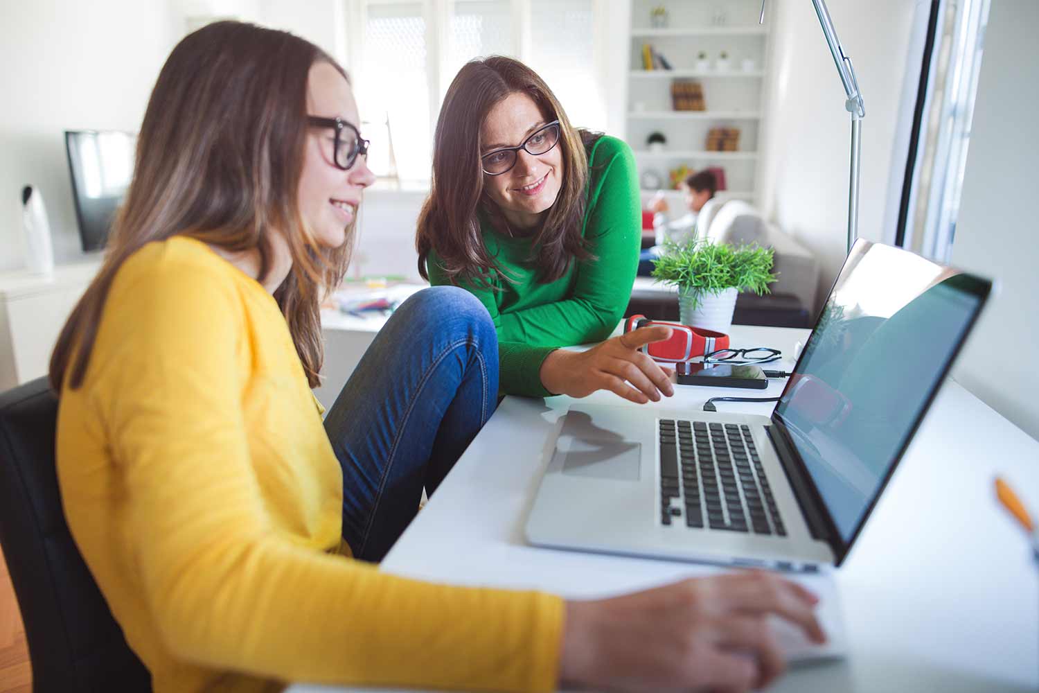 Student and mother with computer