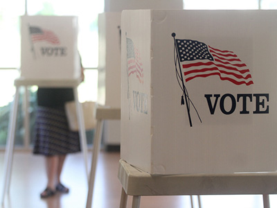 Voting booths stand ready for use in a U.S. election.