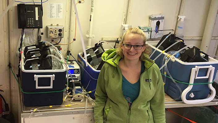 Bethany Kolody prepares water samples aboard the NOAAS Ronald H. Brown, during the P18 GO-SHIP voyage from Easter Island to Antarctica in the South Pacific in 2017.