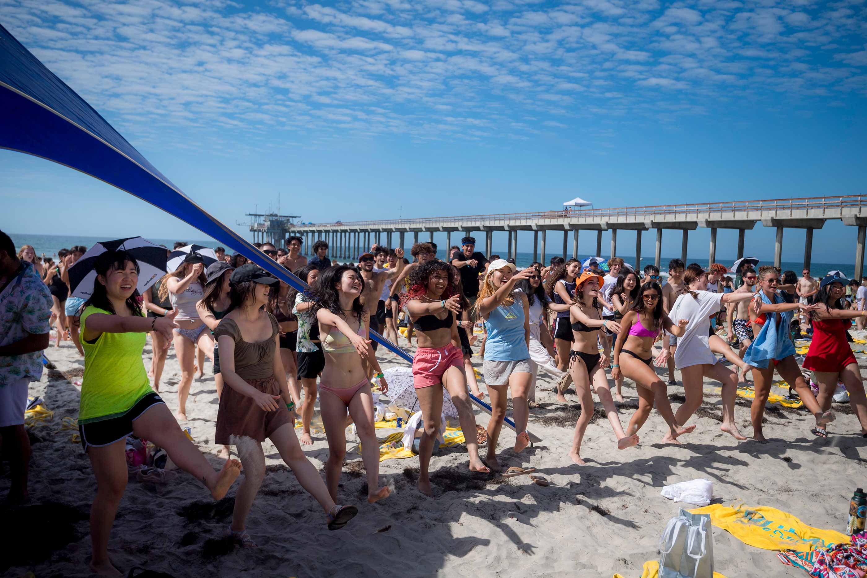 Students dance on beach during Meet the Beach.