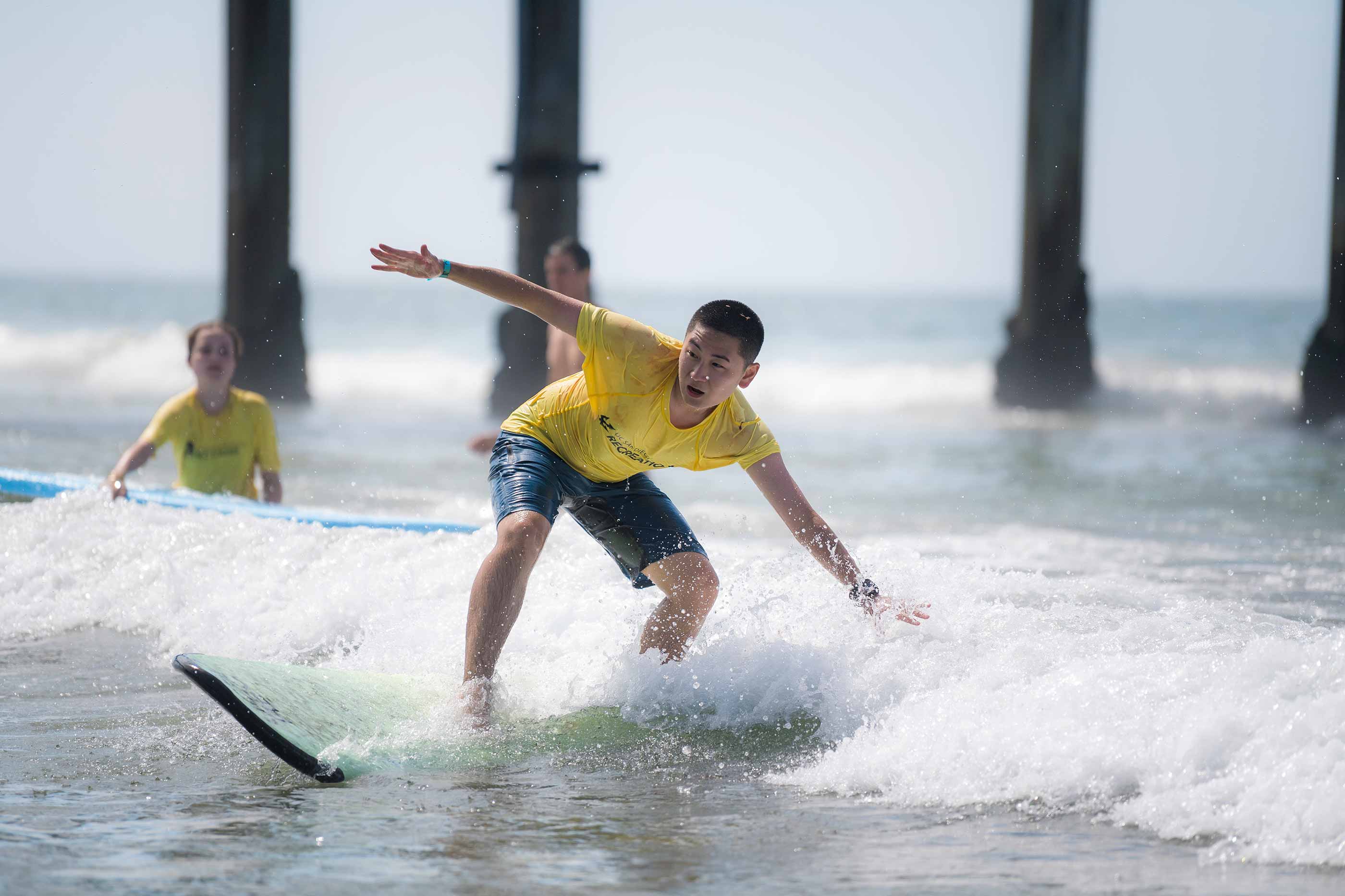 Student catches a wave during meet the Beach.