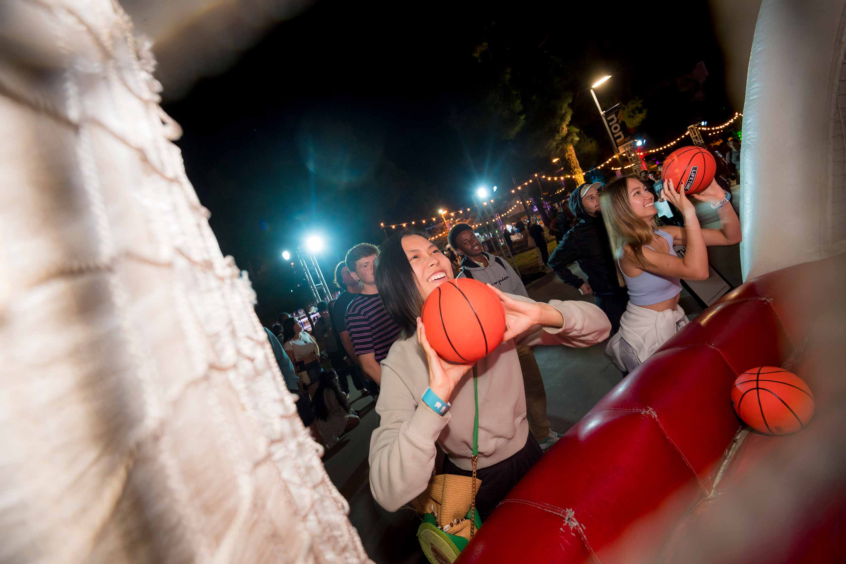Students play carnival basketball game during Fair at the Square.